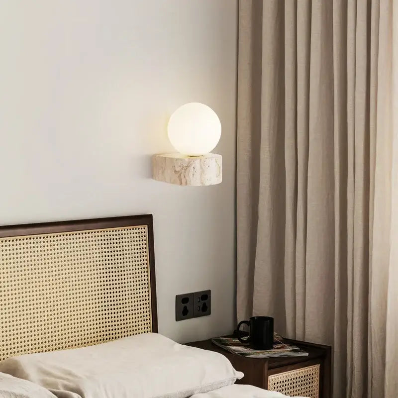 Minimalist stone and glass lampshade wall light with frosted globe on textured base perfect for bedroom wall lights decorbites glass lampshade