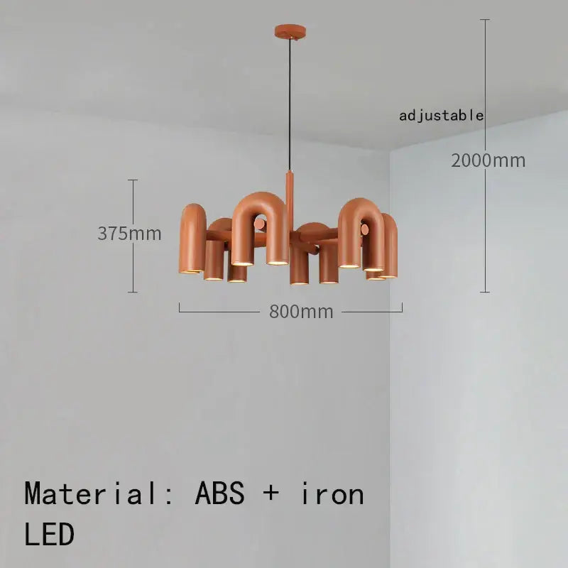 Copper-colored minimalist cirkus tube wall sconce with curved pipe arms made of abs and iron for bedroom reading light
