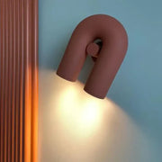 Minimalist terracotta cirkus tube wall sconce with u-shaped matte finish for bedroom reading light