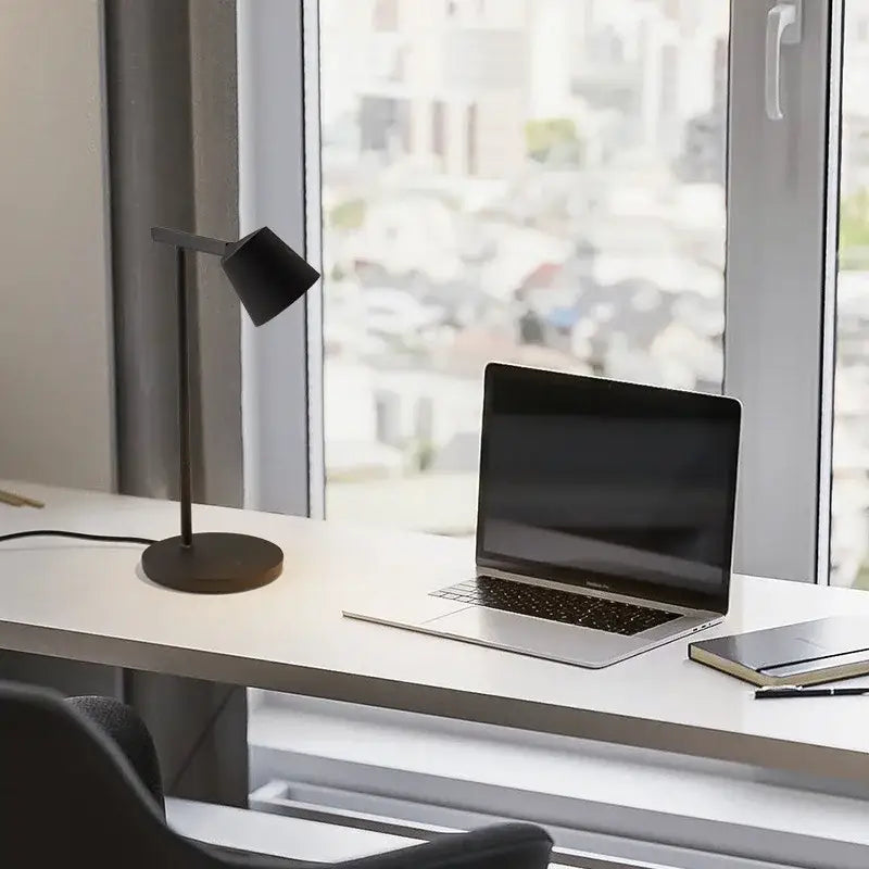 Black minimalist table lamp with matte finish and slender stand for decorbites dimmable desk light bedroom use