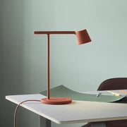 Terracotta minimalist dimmable desk light with sleek matte finish designed as a modern table lamp for bedroom use