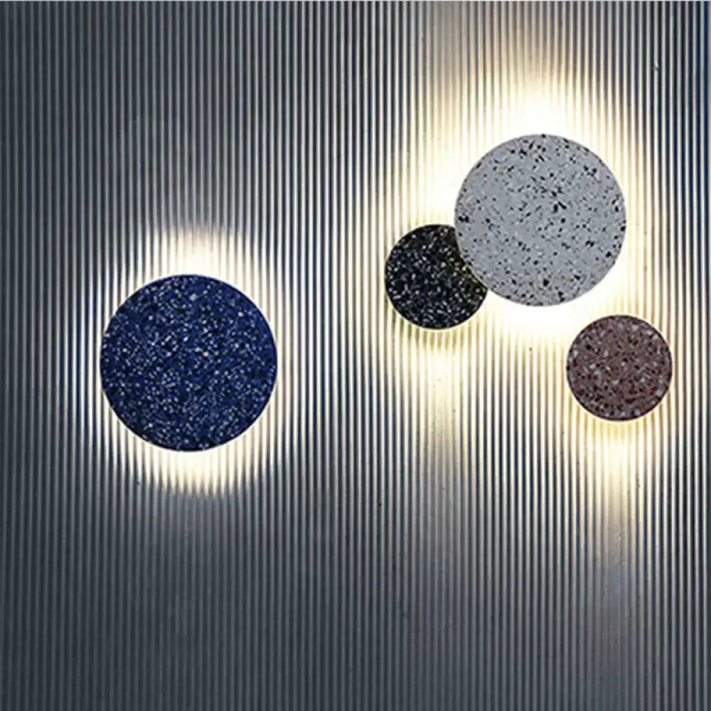 Minimalist terrazzo round led wall sconces with speckled navy black and brown finishes for bedroom lighting
