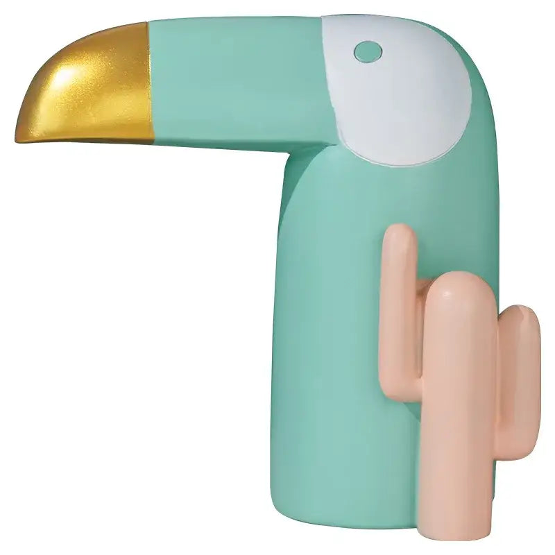 Minimalist mint green decorbites bird figurine desk lamp with gold beak and peach cactus design for office use