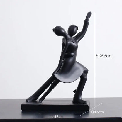 Black matte abstract figures sculpture with minimalist design on rectangular base for living room decor
