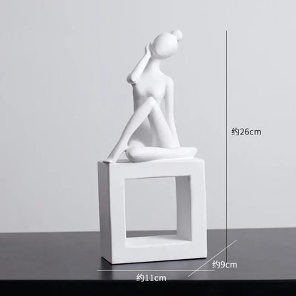 Minimalist white ceramic abstract figures sculpture of a seated woman with hand to ear on a square base for living room decor