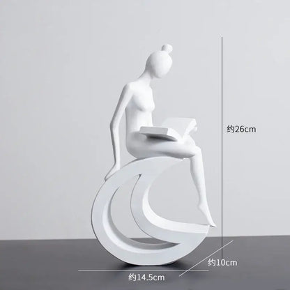 Minimalist white resin abstract figures sculpture of a woman seated on a crescent base reading a book for living room decor