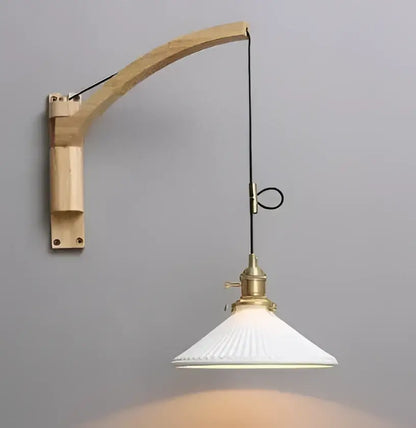Minimalist white and black glass pendant light with vintage wooden arm and brass hardware for bedroom lighting