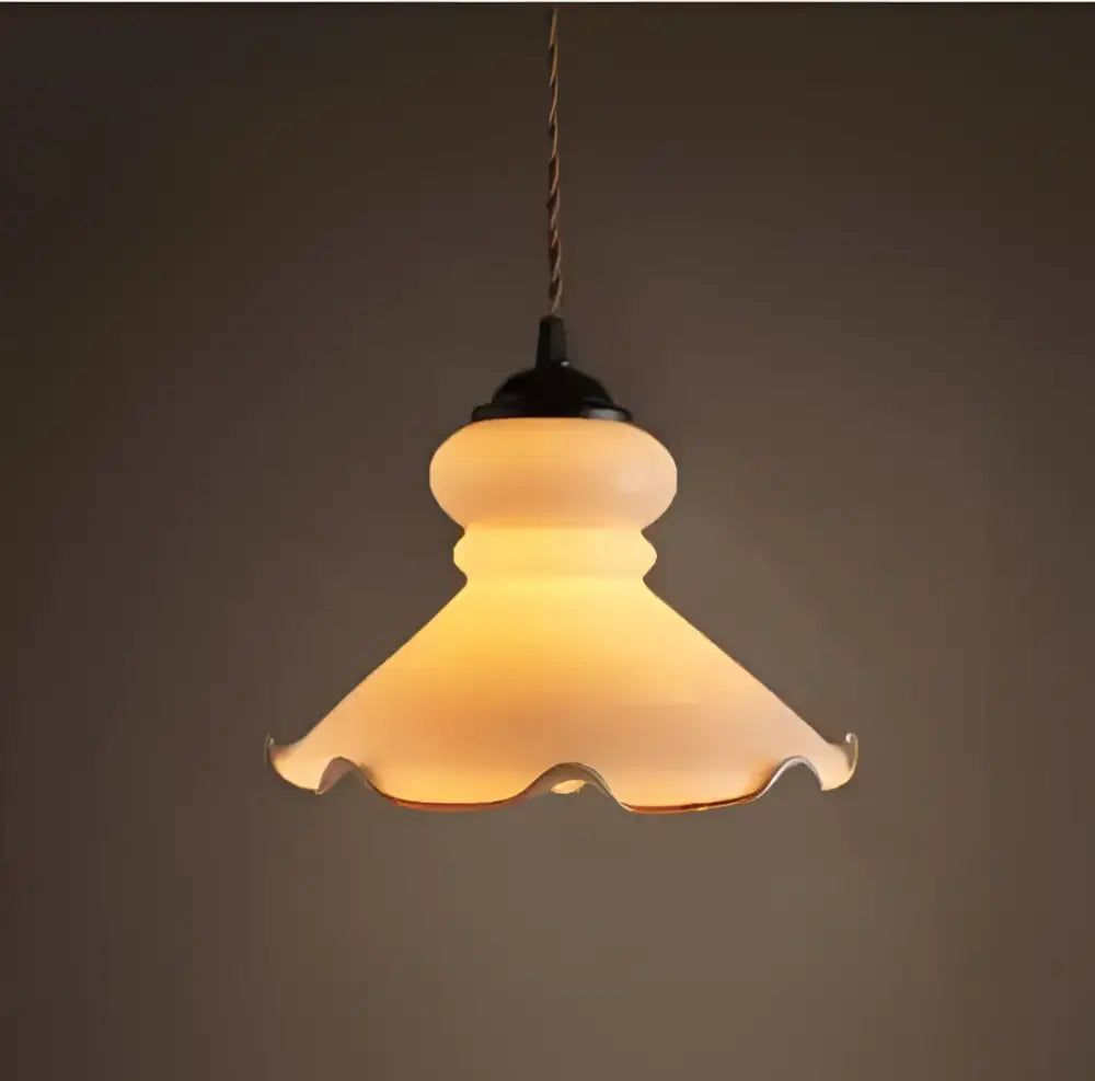 Minimalist white and black glass pendant light featuring warm-toned frosted glass pendant with scalloped edge for bedroom