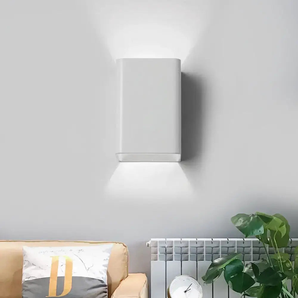 Minimalist white and brass wall lamp with cube shade featuring sleek modern design for bedroom lighting