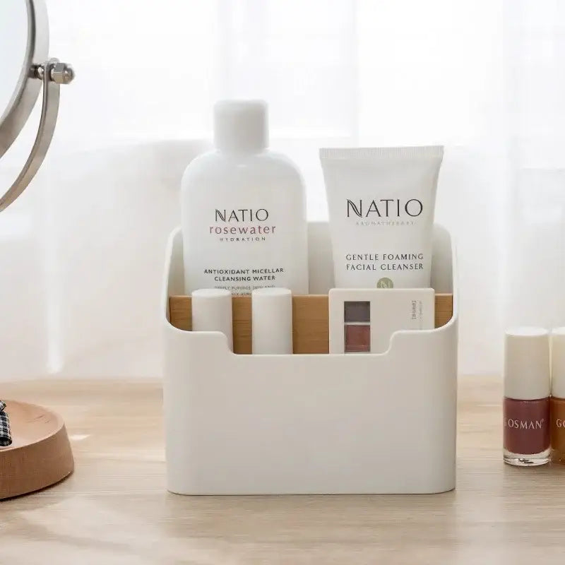 Minimalist white and wood comb-style storage rack holding natio skincare products as an office supplies storage solution