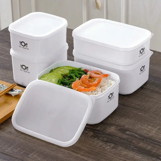 Minimalist white bento box by decorbites featuring rectangular plastic food storage containers with matching lids and logo design