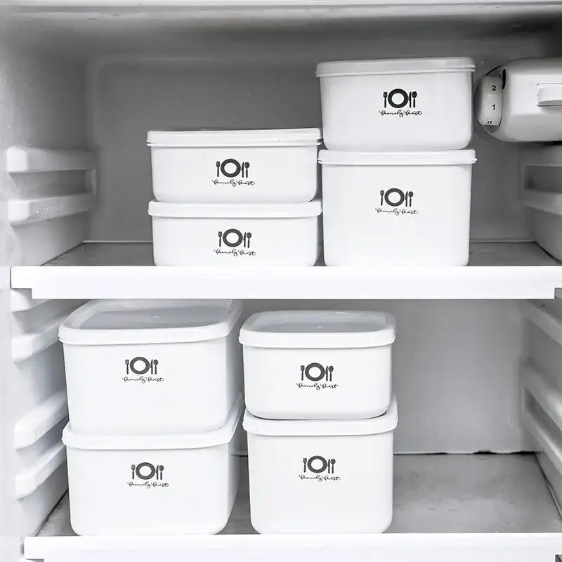Minimalist white decorbites bento box food storage containers with black family feast logo stacked neatly in refrigerator