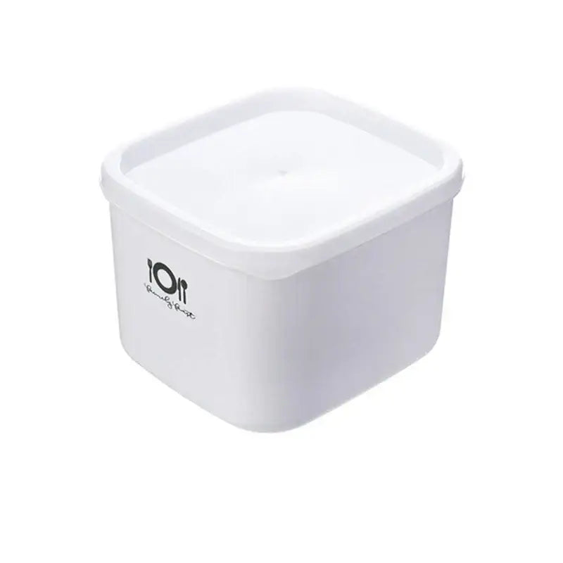 Minimalist white bento box by decorbites featuring plastic storage container with matching lid and black logo for food storage
