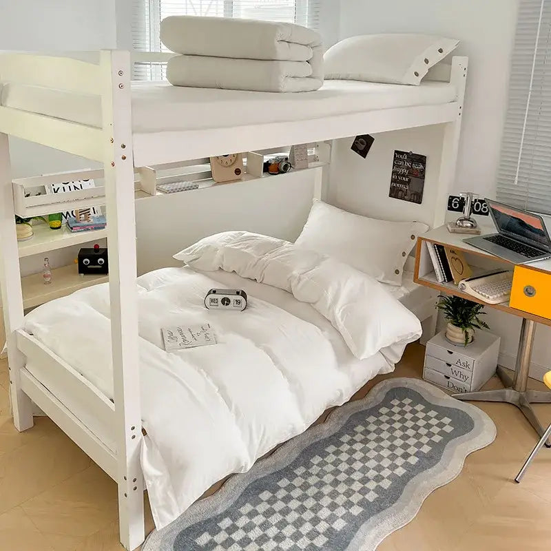 White wooden bunk bed with decorbites buttoned washed cotton bedding set featuring white duvet and pillows