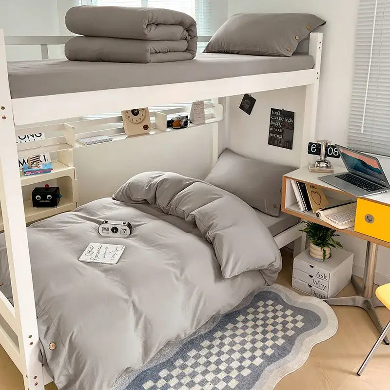 Gray bunk bed with white frame and matching decorbites buttoned washed cotton bedding set in minimalist style