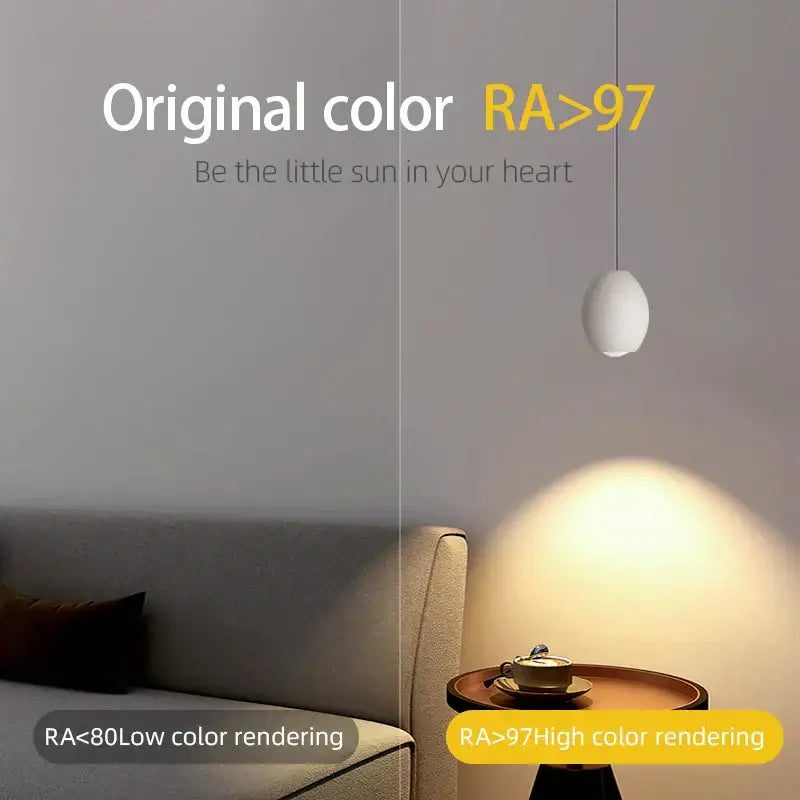 Minimalist white ceramic egg adjustable pendant light hanging from thin cord ideal for kitchen spotlight decorbites adjustable pendant