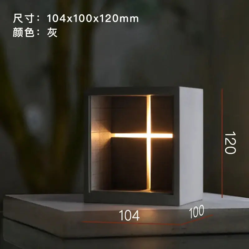 Gray cube-shaped concrete church table lamp with glowing cross design minimalist decorbites bedroom night light