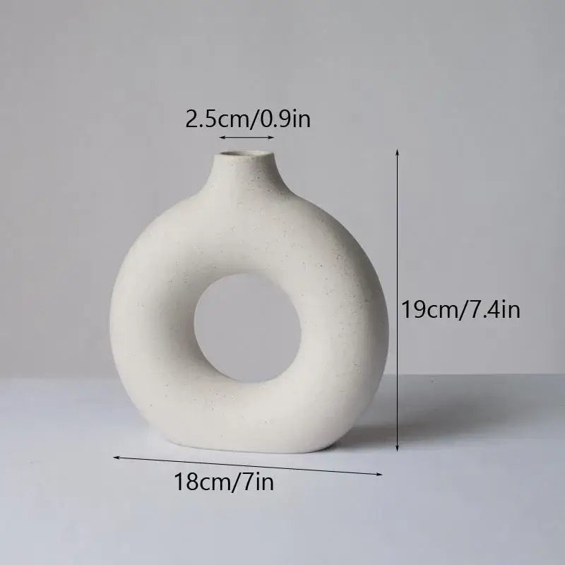 Minimalist off-white decorbites ceramic donut vase with ring-shaped body and narrow neck for living room decor
