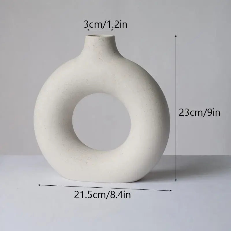Minimalist off-white decorbites ceramic donut vase with ring-shaped body and narrow neck for living room decor