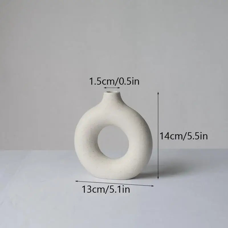 Minimalist white decorbites ceramic donut vase with a ring-shaped body and narrow neck for living room decor