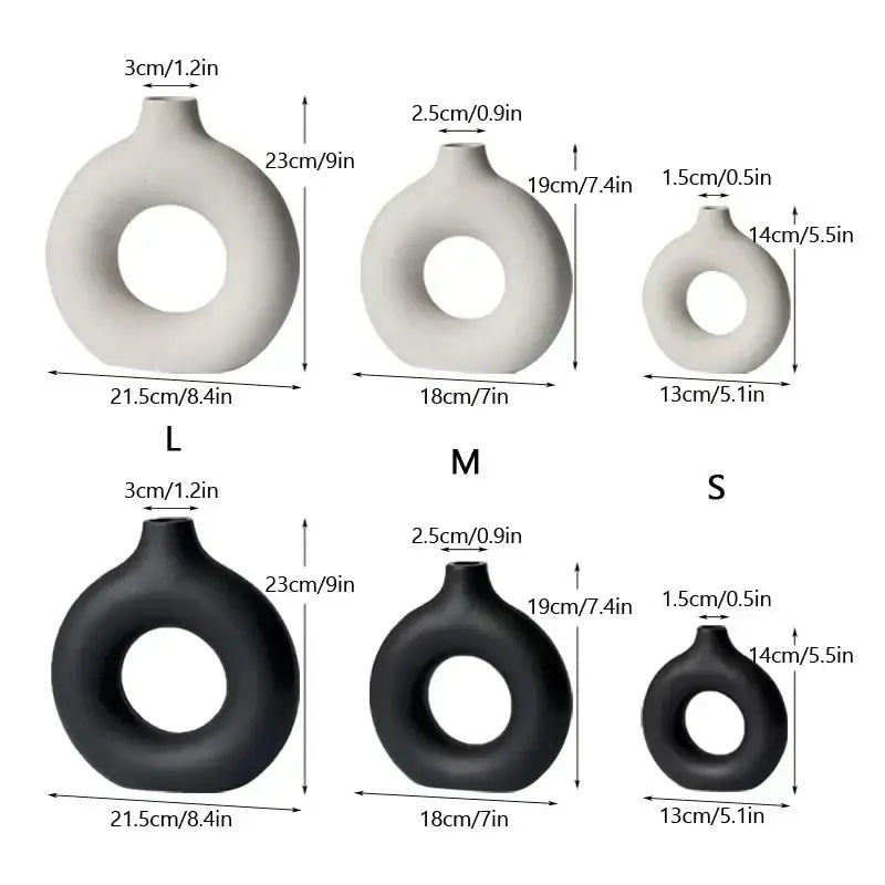 Set of three minimalist decorbites ceramic donut vases in white and black with smooth matte finishes for living room