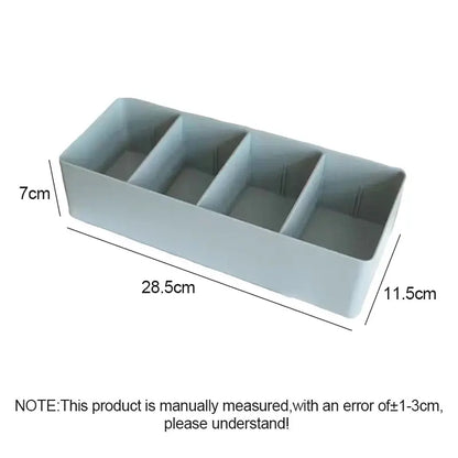 Minimalist light gray plastic divided storage box with four rectangular compartments for kitchen tableware organization
