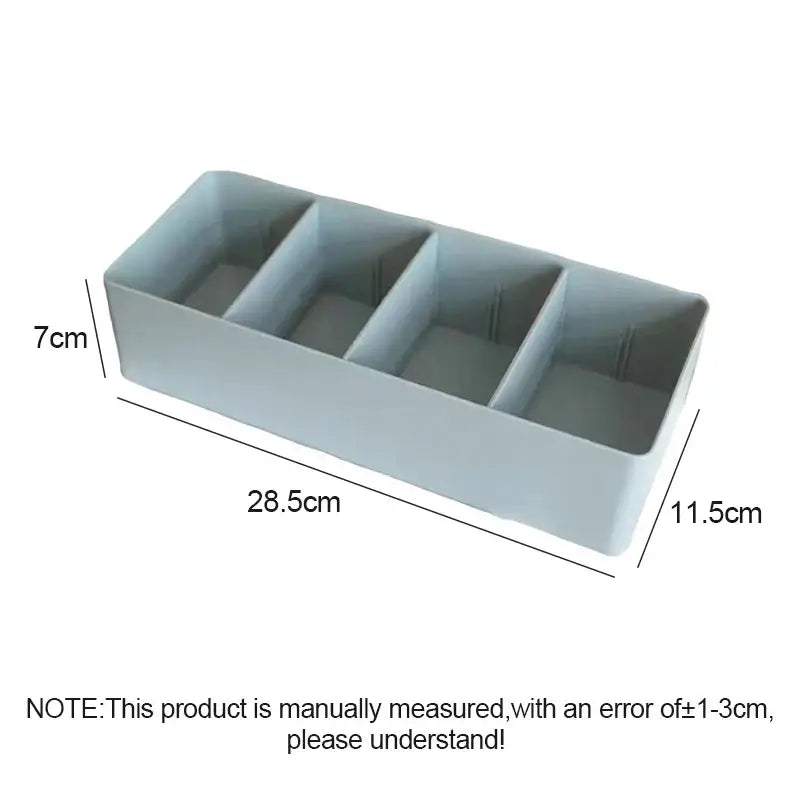 Minimalist light gray plastic divided storage box with four rectangular compartments for kitchen tableware organization