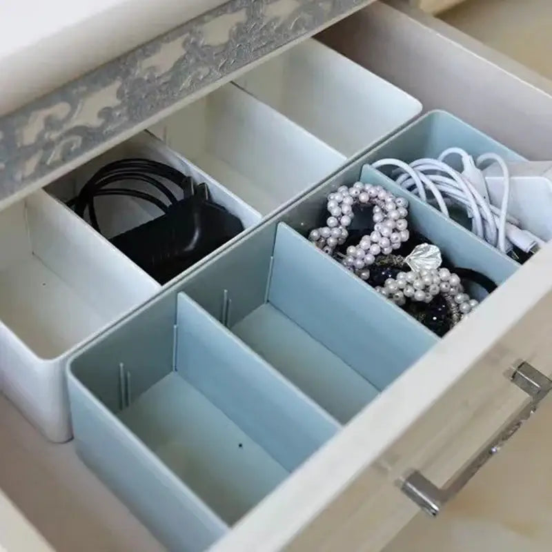 Light blue plastic divided storage box organizer with compartments for minimalist kitchen tableware storage