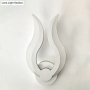 Minimalist white flame wall sconce with sleek minimalist design and LED light for bedroom use