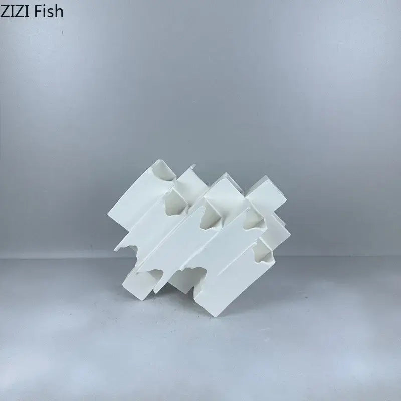 Minimalist white geometric ceramic desk ornament featuring interlocking design as decorbites geometric ceramic decor