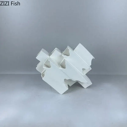 Minimalist white geometric ceramic desk ornament with interlocking fish-shaped design for modern decorbites geometric ceramic decor
