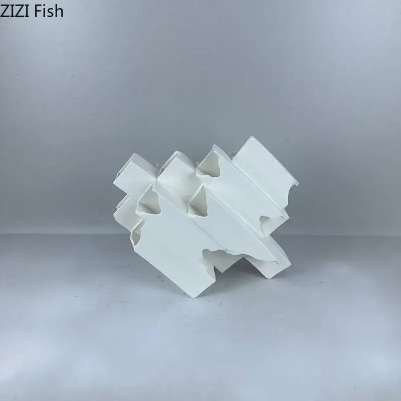 Minimalist white geometric ceramic desk ornament with interlocking fish-shaped design for modern decorbites geometric ceramic decor