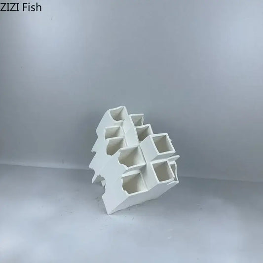 Minimalist white geometric ceramic desk ornament featuring multi-tiered hollow compartments for decorbites geometric ceramic decor