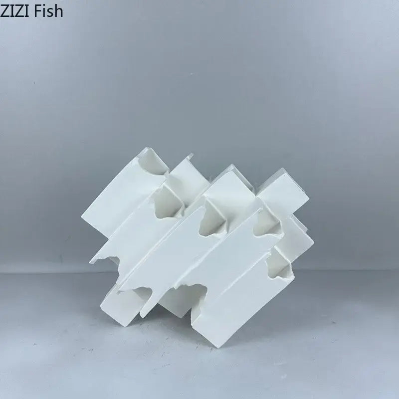Minimalist white geometric ceramic desk ornament featuring interlocking angular segments for modern decorbites geometric ceramic use