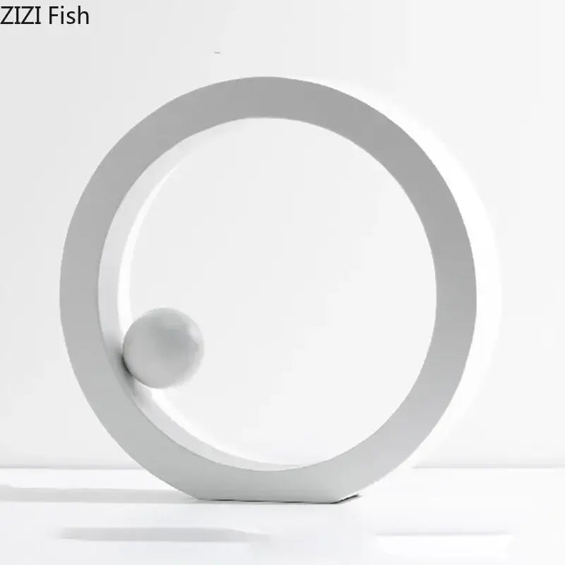 Minimalist white geometric circle desk ornament with a spherical element for modern office decor by decorbites geometric circle