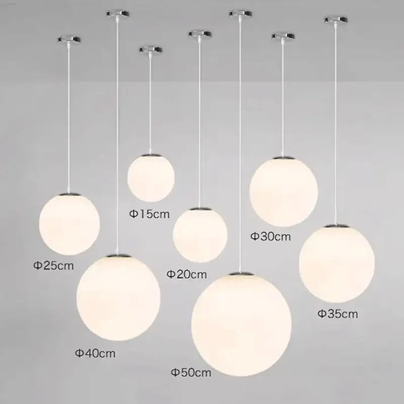 Set of minimalist white glass ball pendant lights in frosted glass with chrome fixtures for dining room decorbites glass ball
