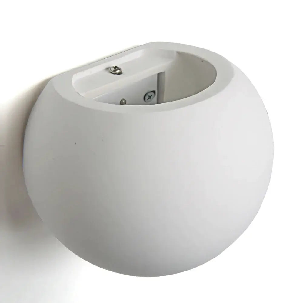 Minimalist white spherical gypsum wall lamp with matte finish and visible screws for living room diffused light