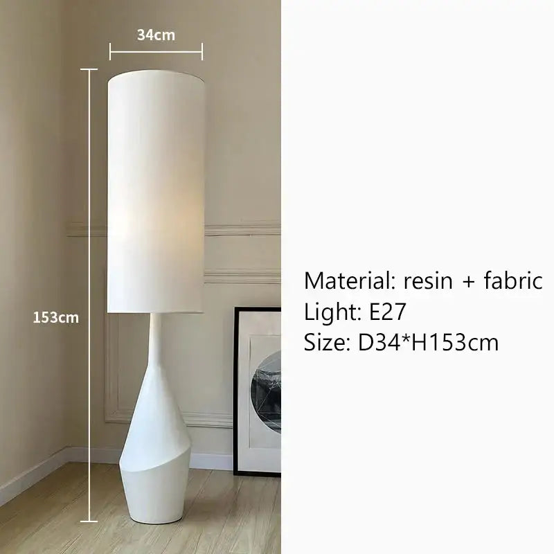 A sleek white led floor lamp with a cylindrical fabric shade and resin sculpted base, 153cm tall for living rooms