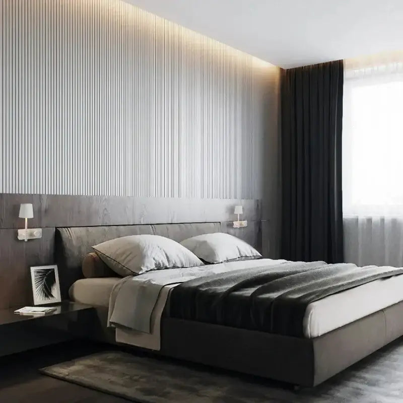 Modern gray upholstered bed with dark wood headboard paired with minimalist white led usb wall lamp for bedroom use
