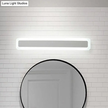 Minimalist white led vanity light with sleek rectangular frame and soft warm third gear illumination for bathroom wall use