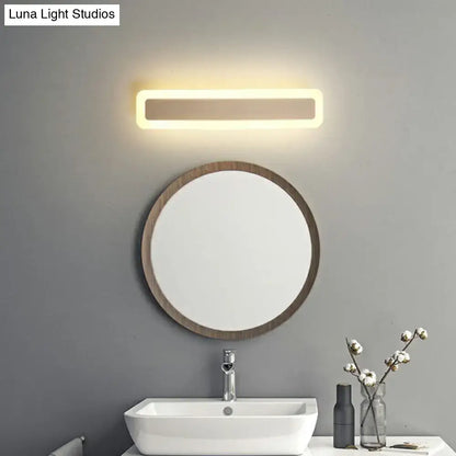 Minimalist white led vanity light bathroom wall sconce with warm glow and sleek metallic finish for modern warmth