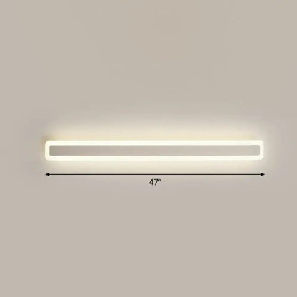 A sleek minimalist white 47-inch led vanity light wall sconce with warm third gear soft illumination for bathroom use
