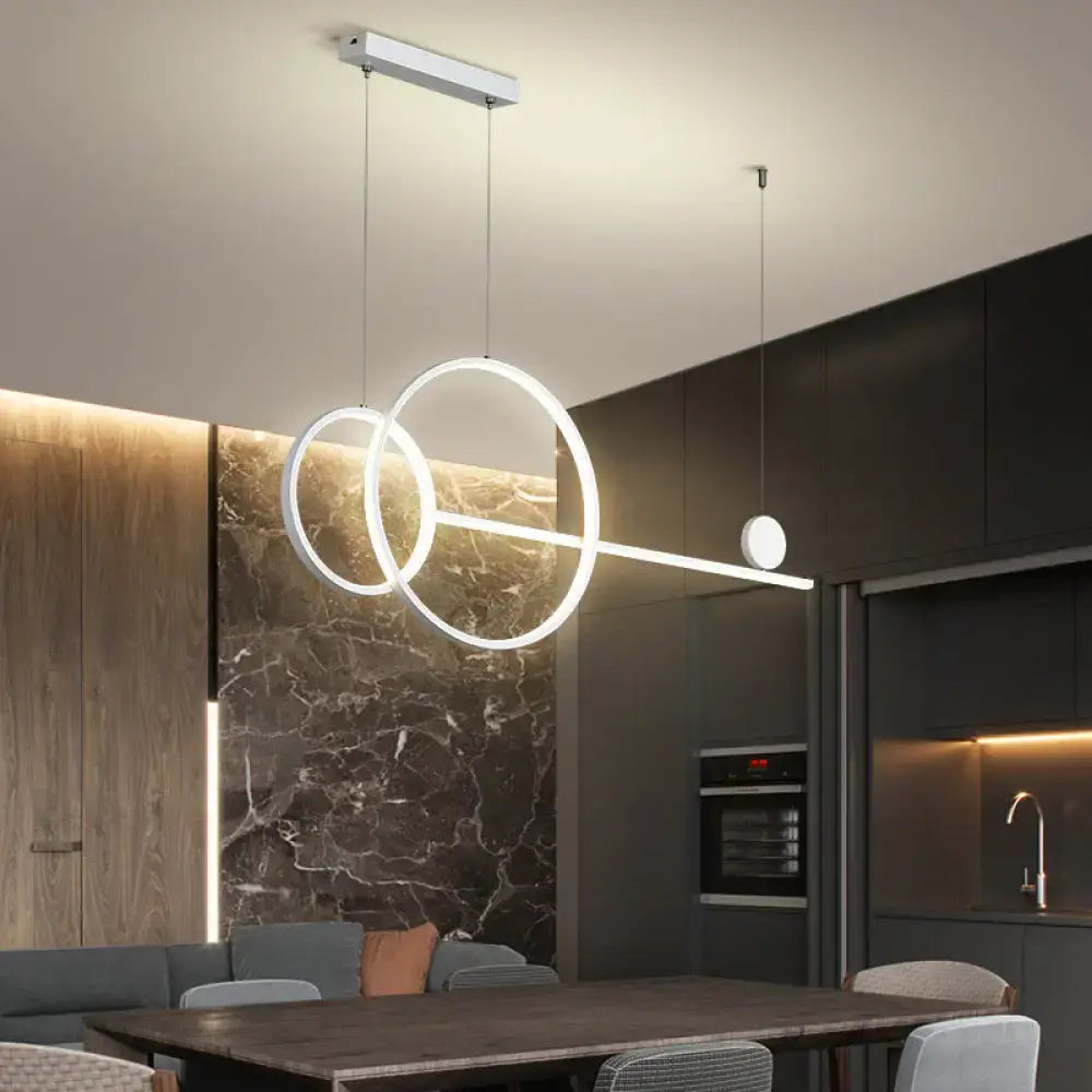 Modern white metal DecorBites™ linear led hanging lamp with interlocking rings and sleek bar for dining rooms and islands