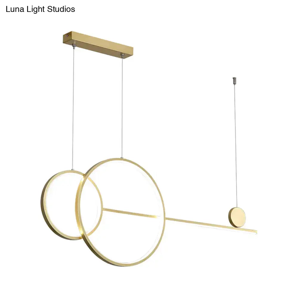 Modern gold-toned metal DecorBites™ linear led hanging lamp with overlapping rings and disc accent for dining rooms and islands