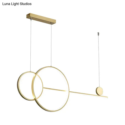 Modern gold-toned metal DecorBites™ linear led hanging lamp with overlapping rings and disc accent for dining rooms and islands