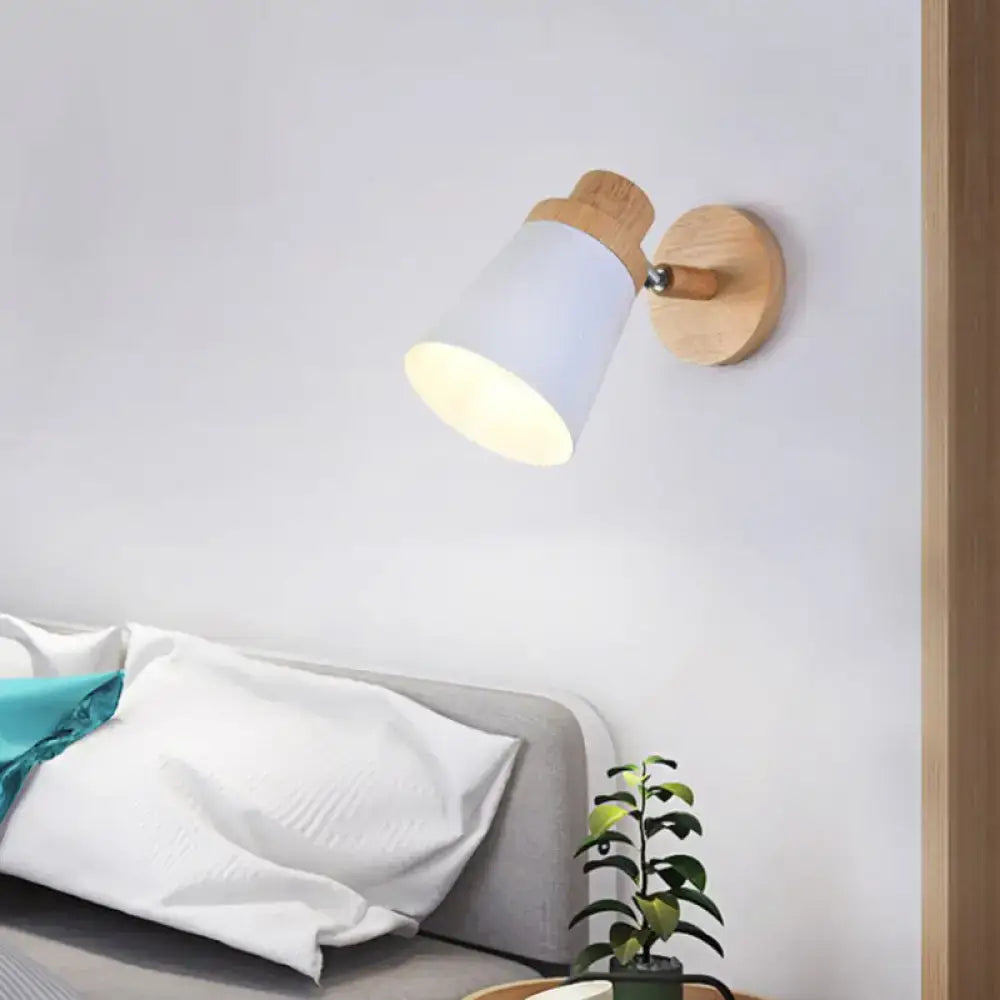 Minimalist white metal barrel wall lamp with a conical shade and natural wood accents as a living room wall lamp sconce