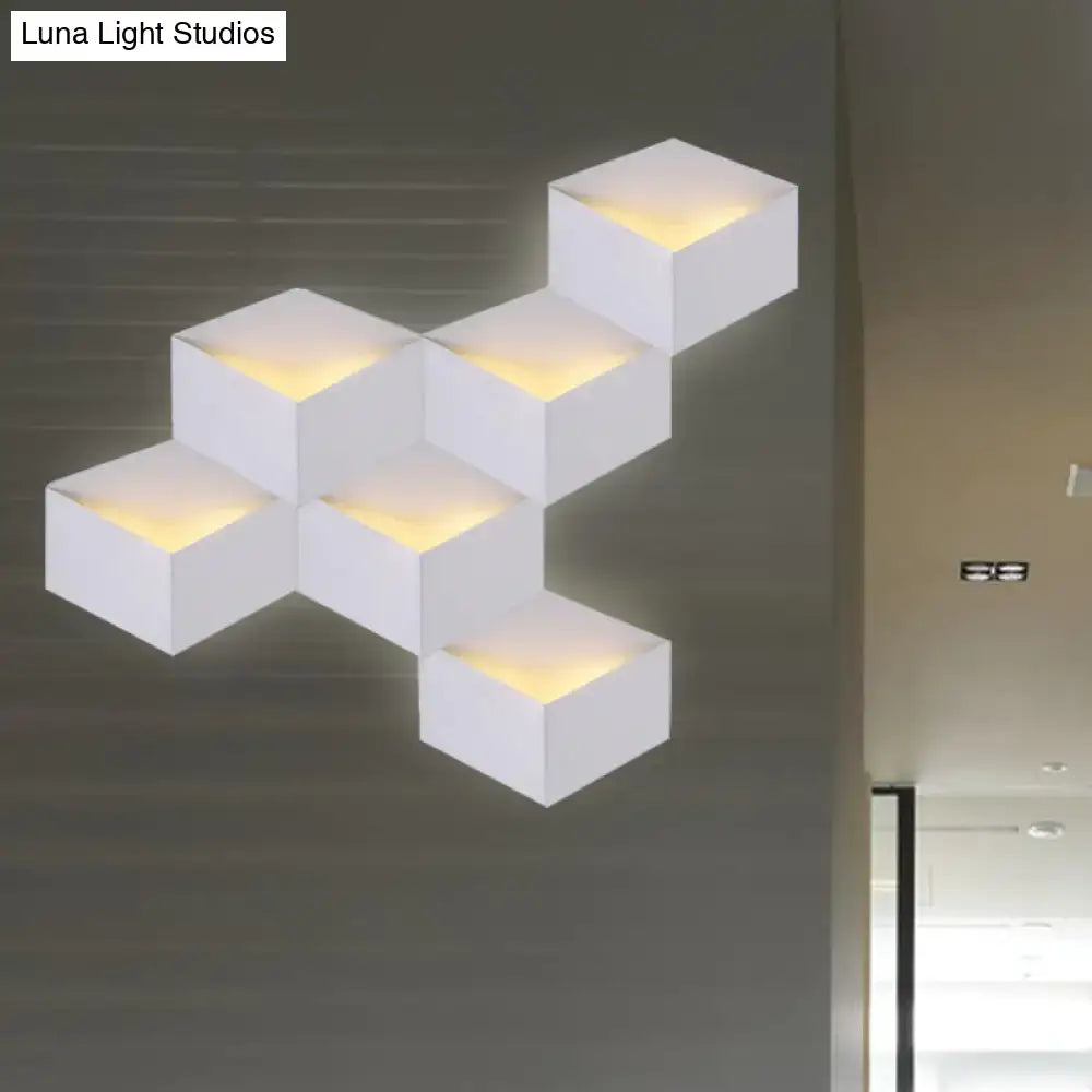 Minimalist white metallic geometric wall lamp with warm yellow illumination for corridor lighting and geometric wall mount