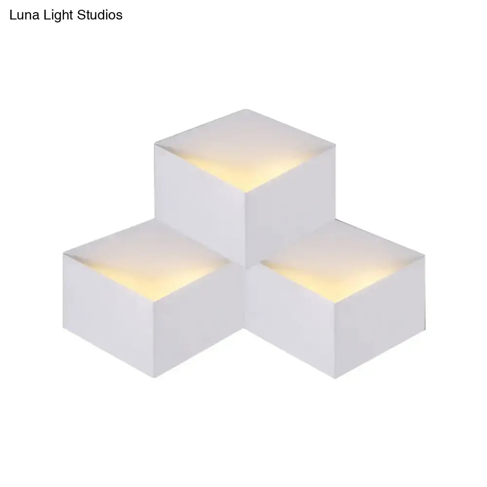 Minimalist white metallic geometric wall mount light with cube shape and warm top glow for corridor wall lamp