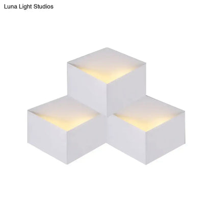 Minimalist white metallic geometric wall mount light with cube shape and warm top glow for corridor wall lamp