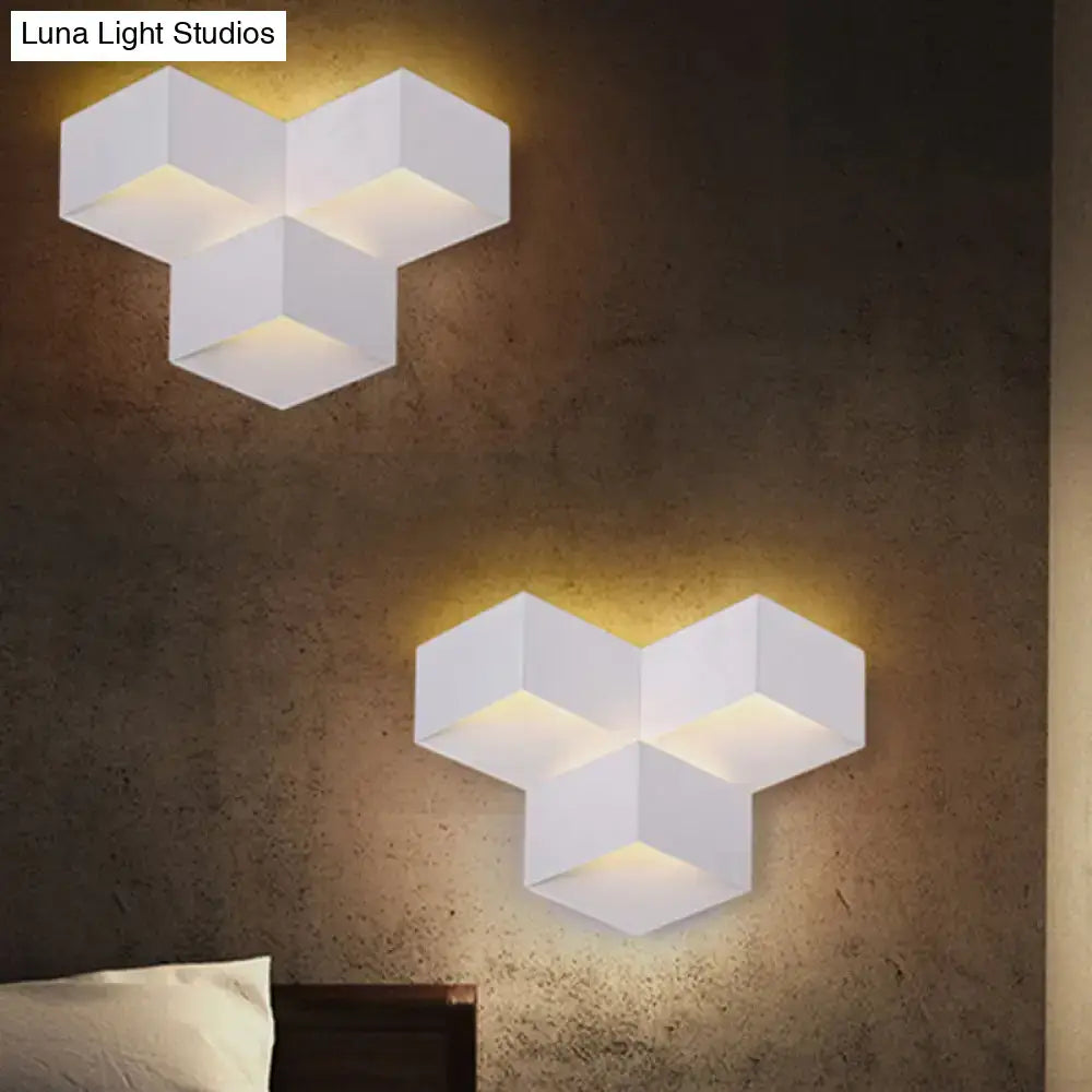 Minimalist white metallic geometric wall lamp with three-dimensional hexagonal design for corridor use